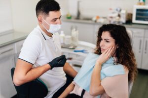 An emergency dentists in Littleton. Doctor is checking an emergency patient.